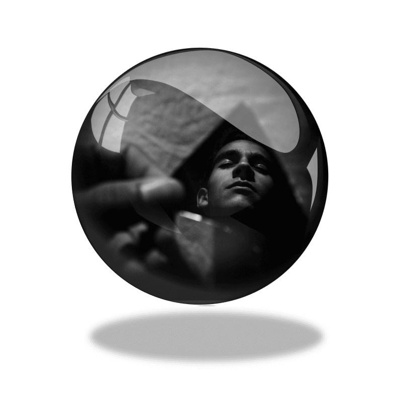 Image of someone seeing themselves in a shard of mirror - metaphor for self-reflection and ORID