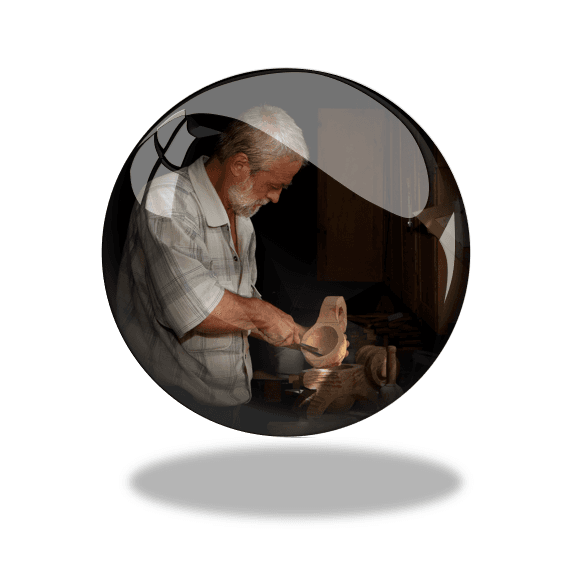 modelling mastery - a picture of a master wood carver at work